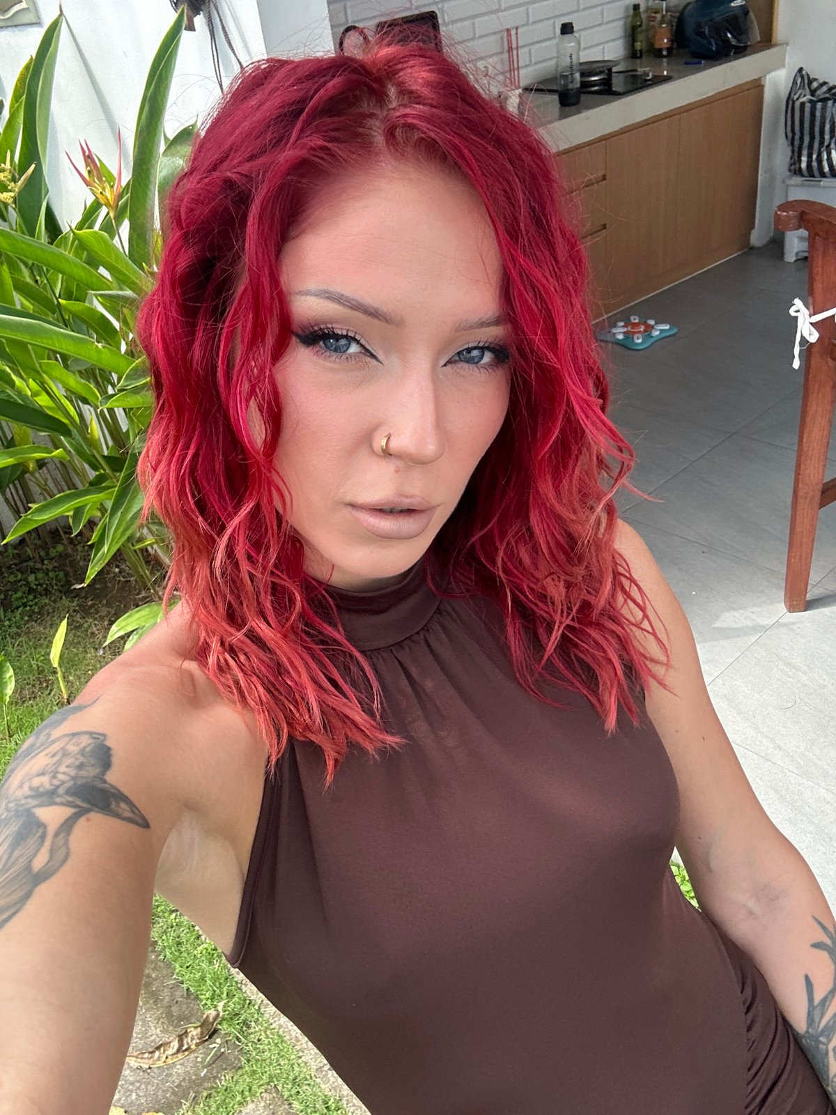 Tattooed woman observed in outdoor North Kuta setting