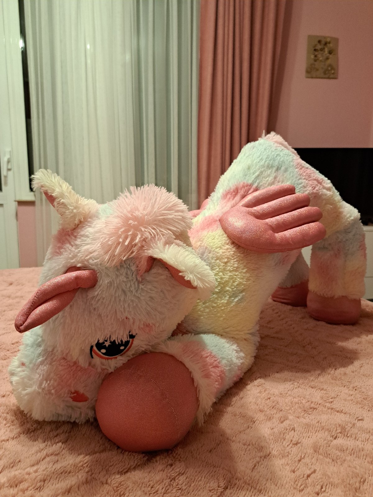Plush unicorn toy spotted on pink blanket in Bulgaria