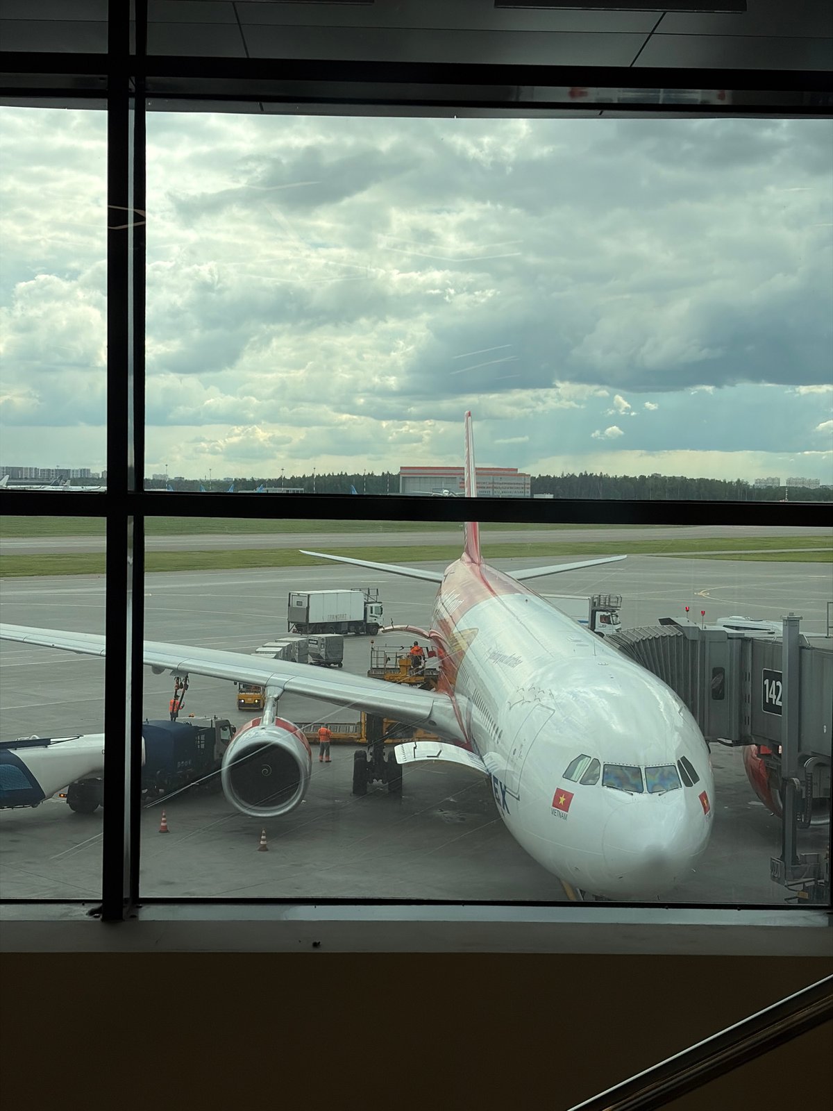 Mother and baby travel through Moscow's Sheremetyevo Airport