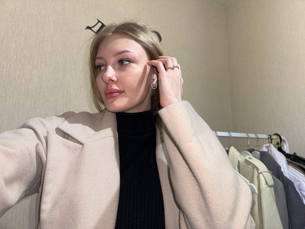 Woman takes selfies indoors in Perm, Russia