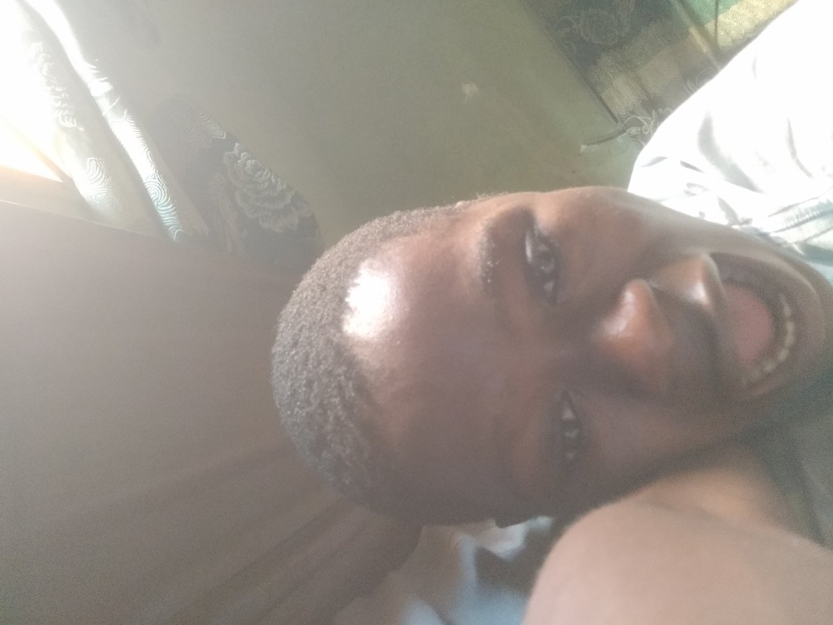 Person takes casual selfies while resting indoors in Shangisha