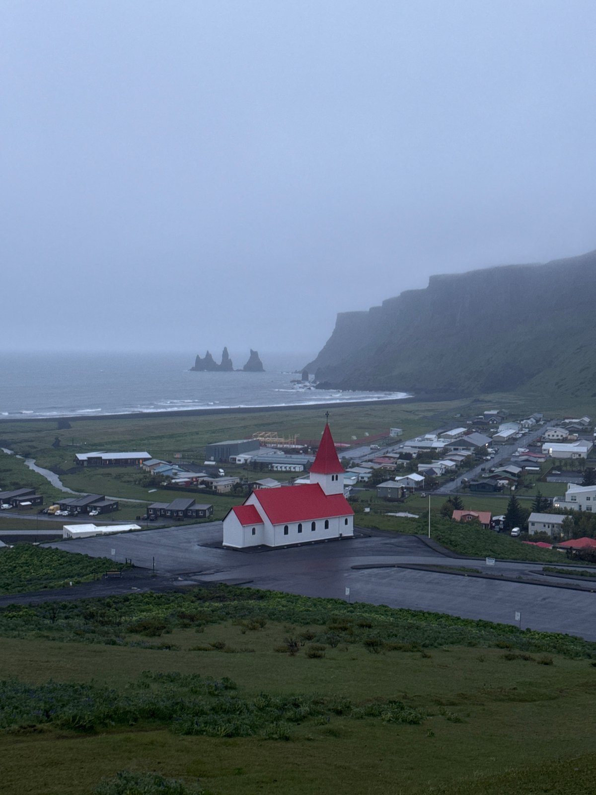 Rainy evening views of iconic Vikurkirkja Church documented in Vik