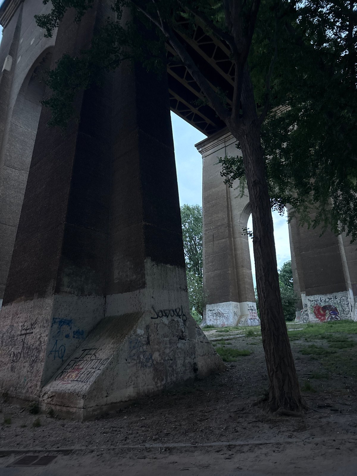 Graffiti-covered bridge underside documented in New York