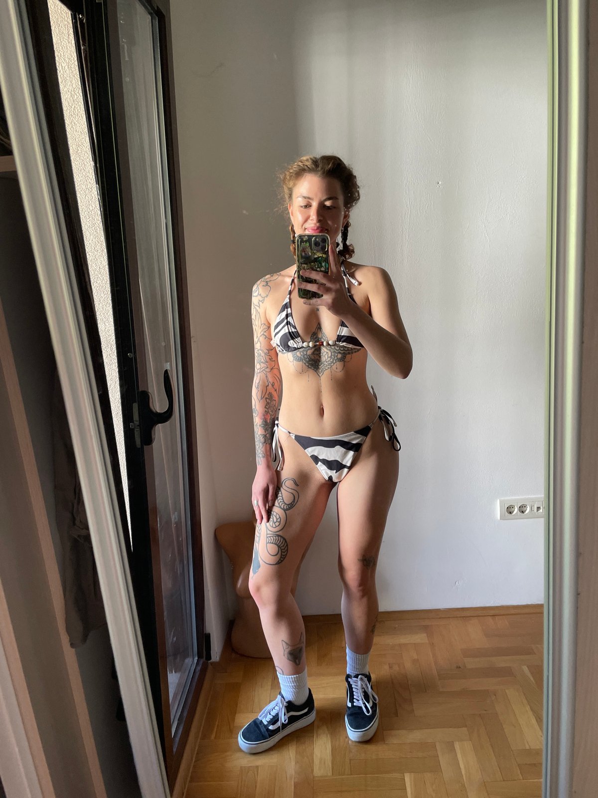 Person takes mirror selfies in Boreti, Montenegro room