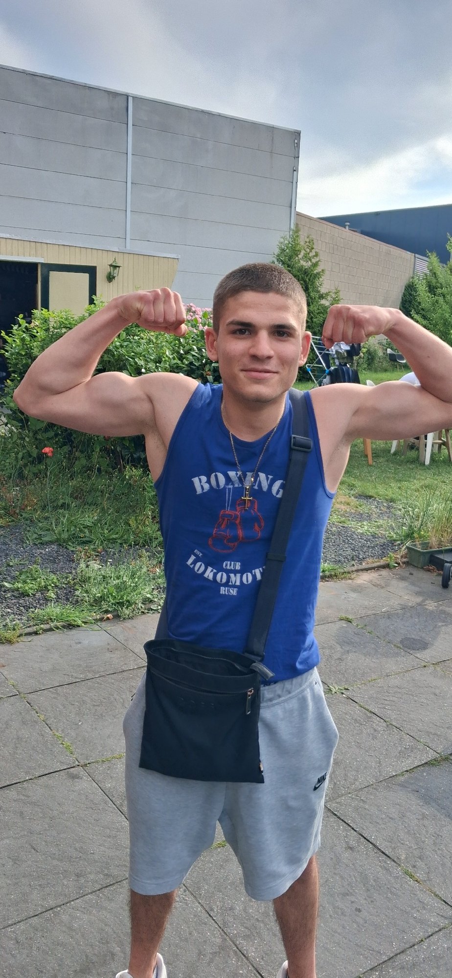 Young boxer displays physique outdoors in Ede, Netherlands