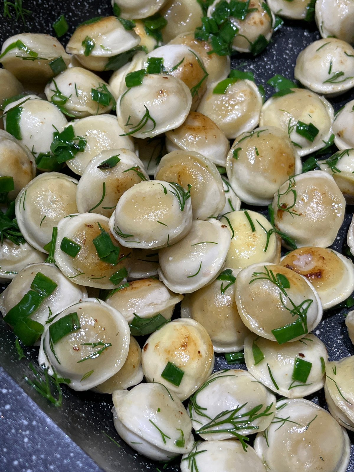 Lunch at home: pelmeni and a baby in a high chair