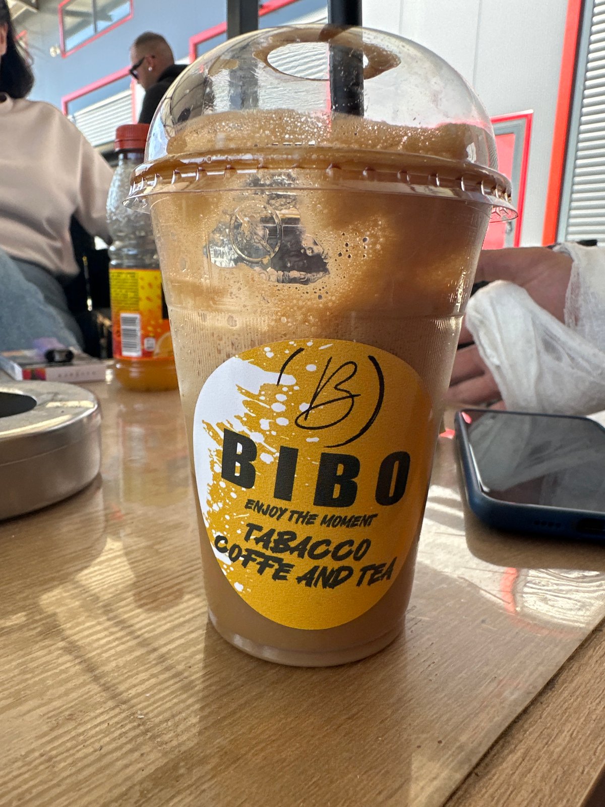 BIBO drink spotted at outdoor cafe table