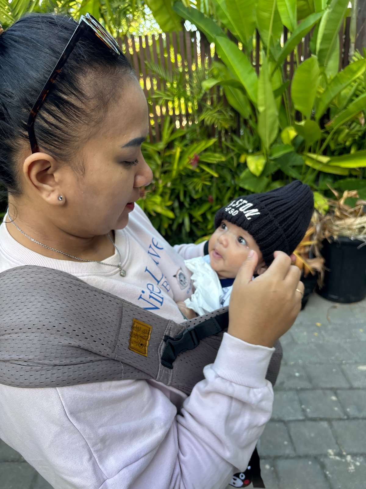 Baby outing in a lush Mengwi garden setting