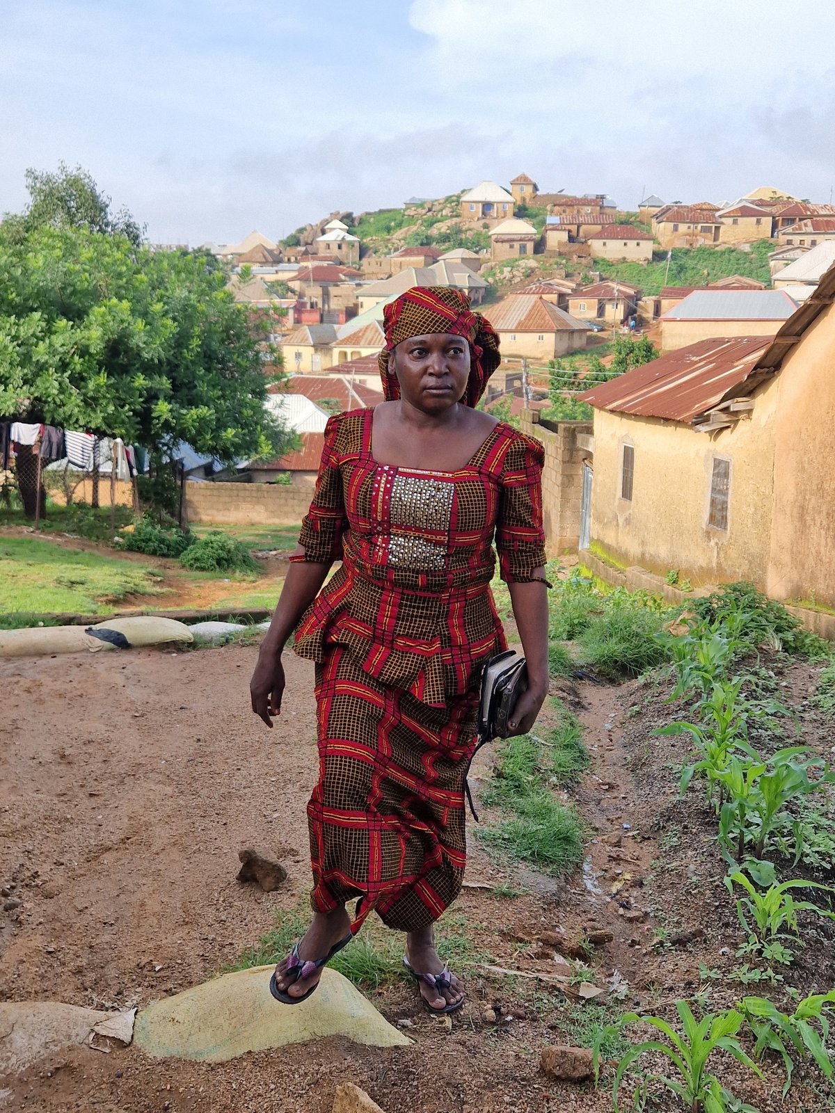 Morning street life in Jos, Nigeria, people and surroundings