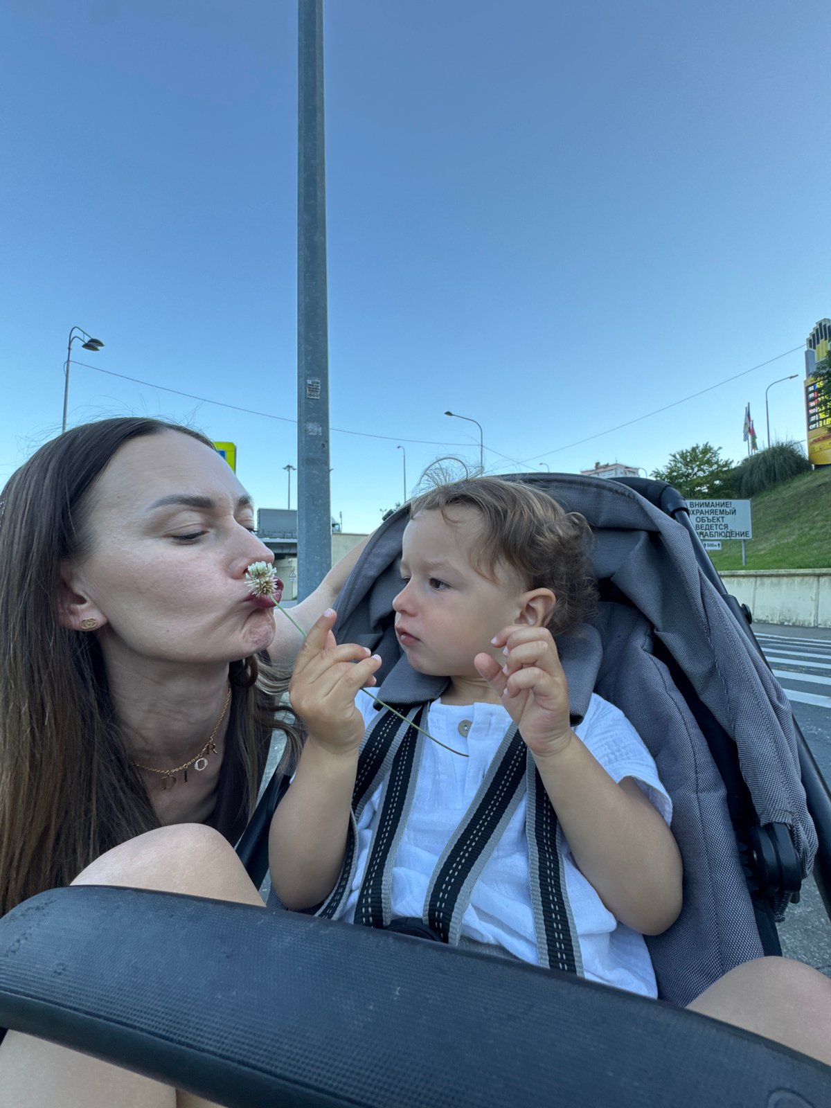 Parent and toddler enjoy afternoon outing in Sochi playgrounds