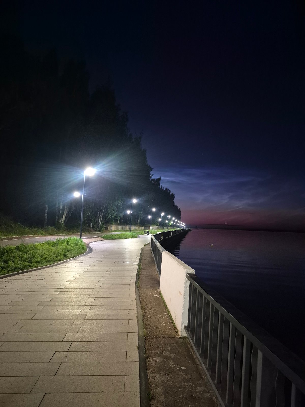 Evening stroll along Kama River promenade in Chaikovsky