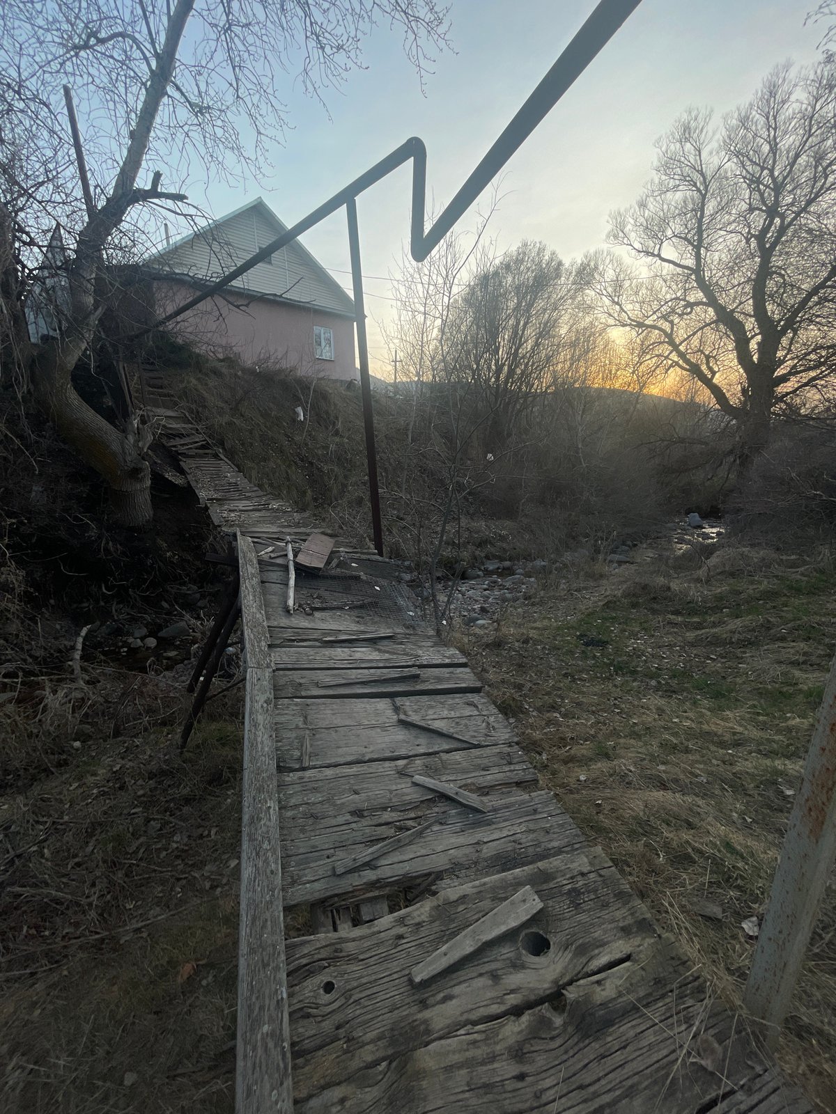 Deteriorating wooden footbridge spotted in Алмалық, Kazakhstan