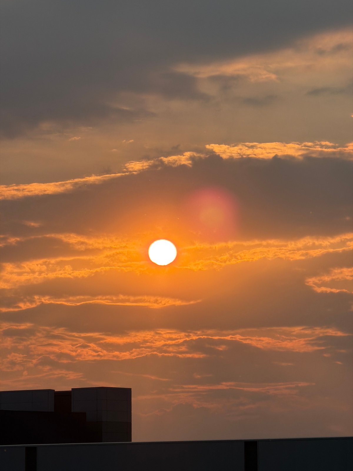 Qatar Airways aircraft photographed during dramatic sunset at London airport