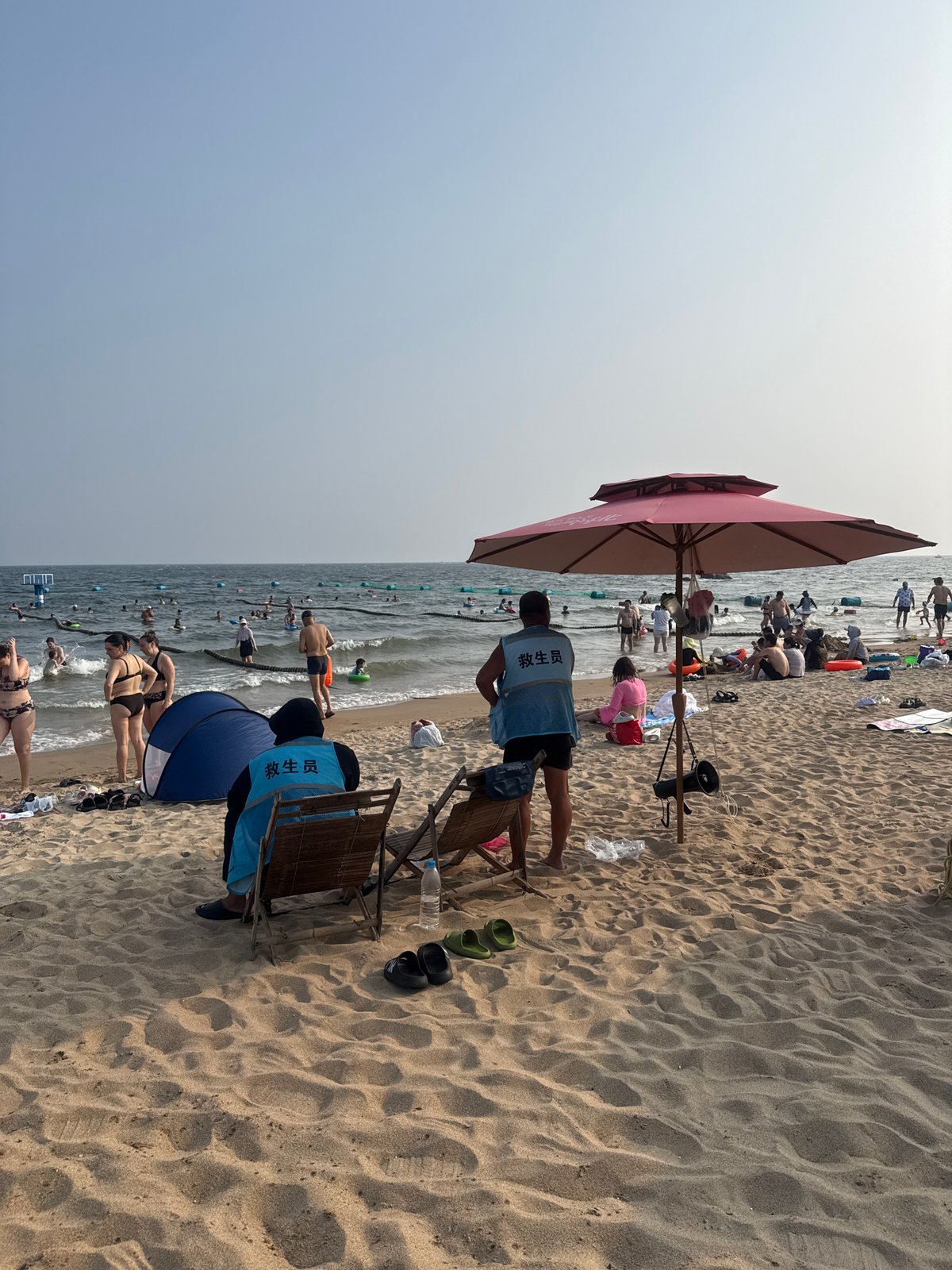 Lifeguards on duty at crowded Beidaihe beach, Qinhuangdao