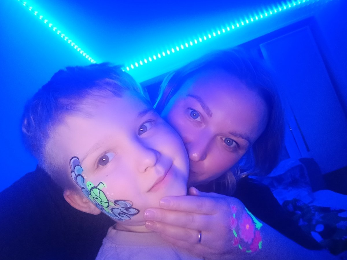Family celebrates with blacklight party in Chaikovsky, Russia