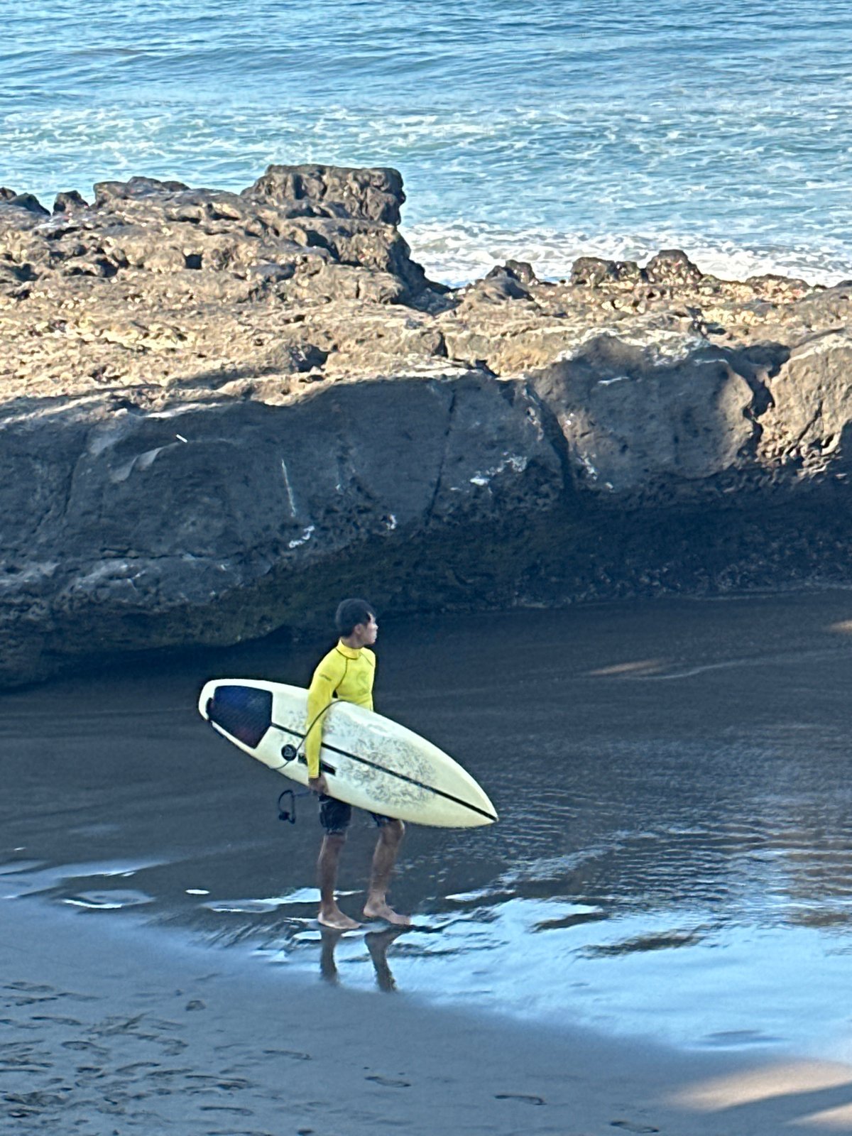 Morning beach activity along North Kuta's shoreline