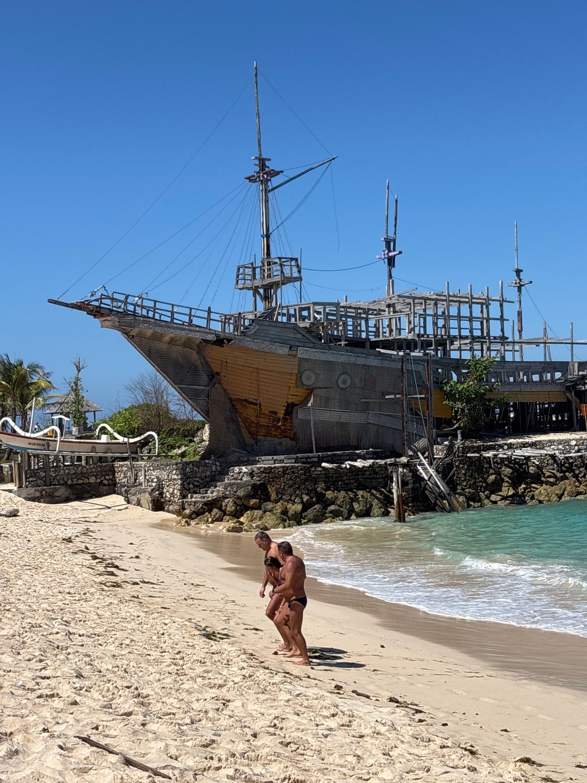 Beach day at Kuta Selatan, Bali, around a striking pirate ship landmark
