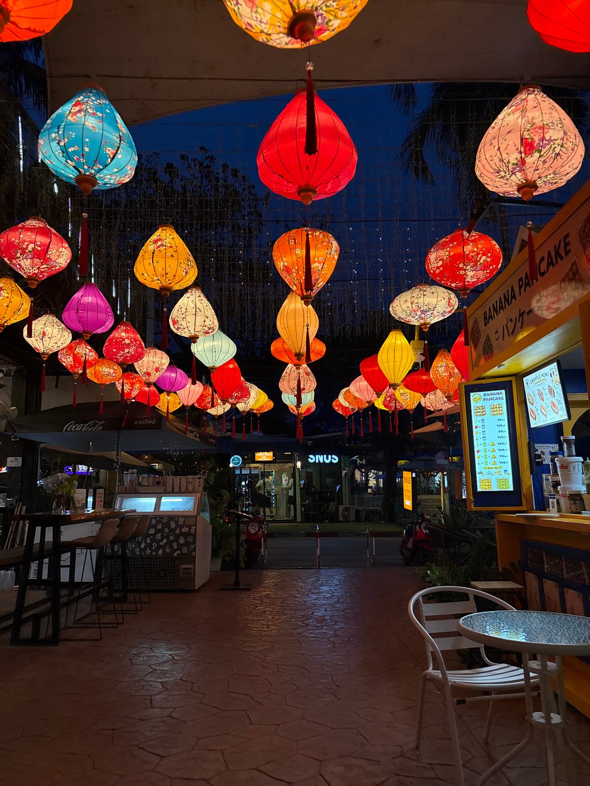 Porto de Phuket glows at dusk under hundreds of colorful lanterns