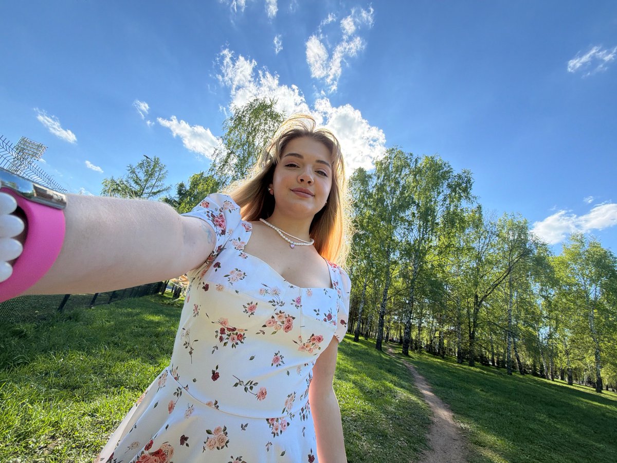 Woman in floral dress photographed outdoors in Naberezhnye Chelny