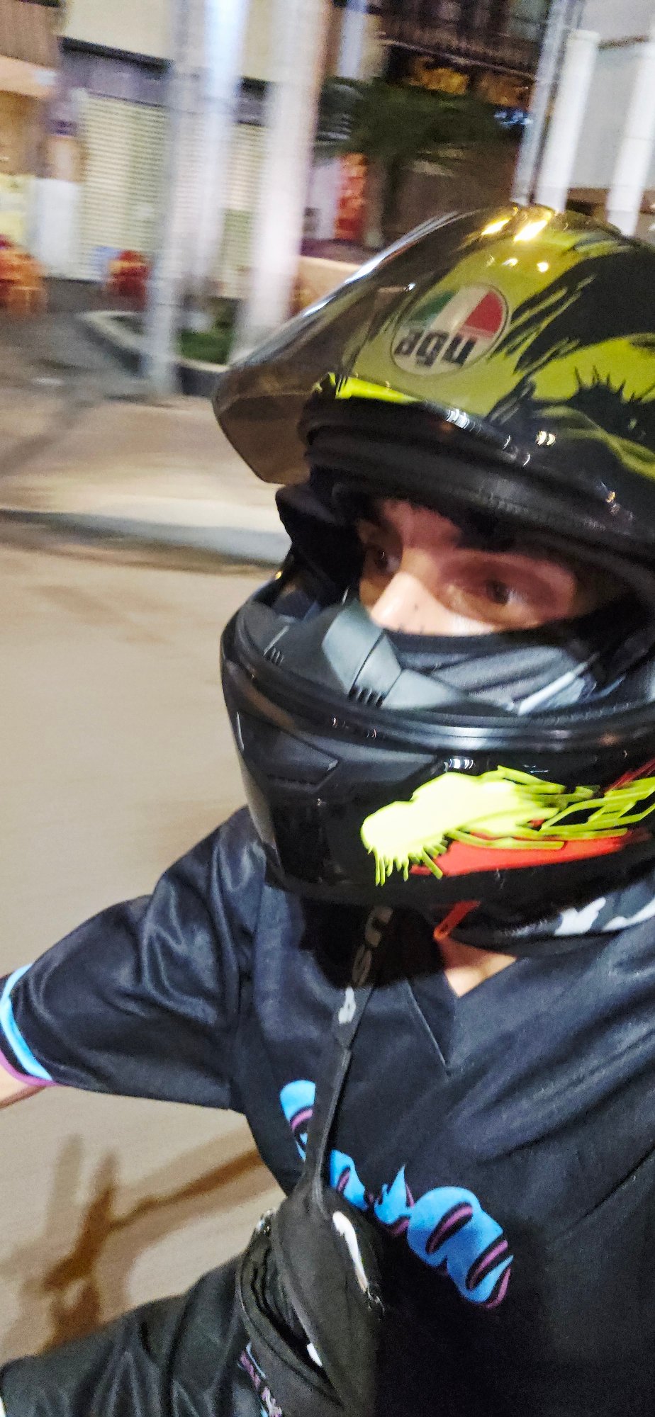 Motorcyclist waits at red light intersection in Nha Trang
