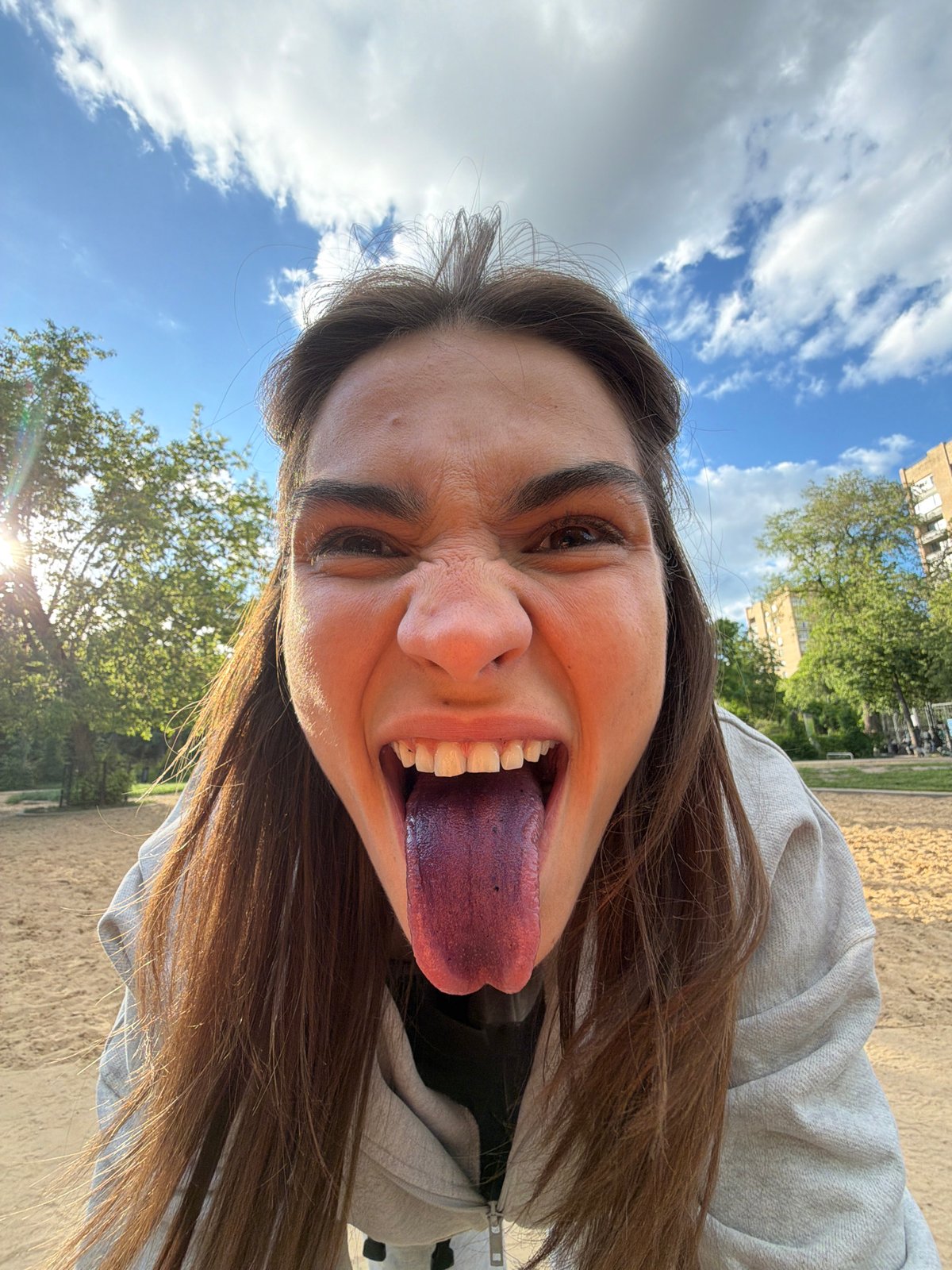 Woman photographed in Moscow park during afternoon outing