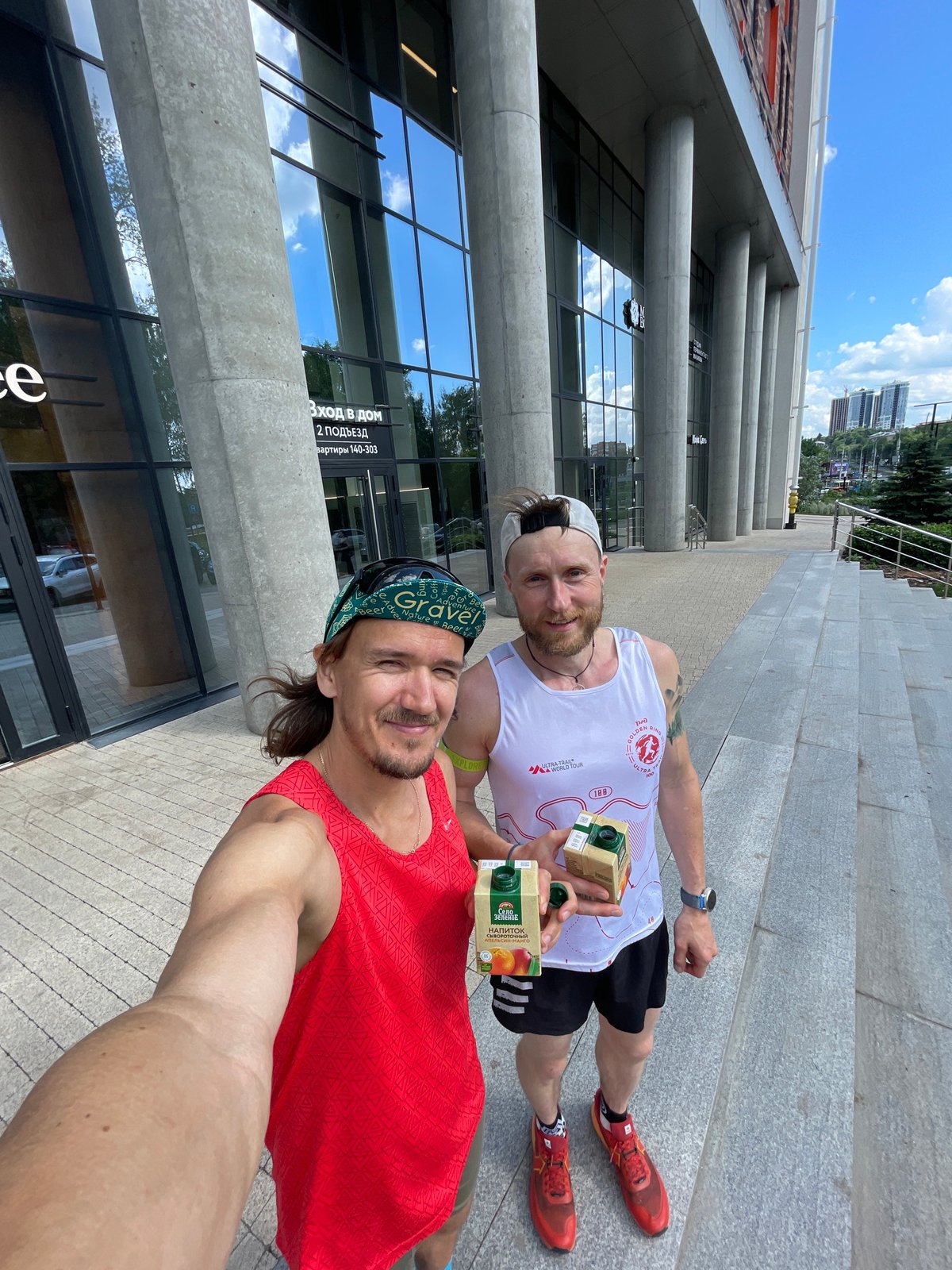 Trail run selfies through forest, starting from a modern building