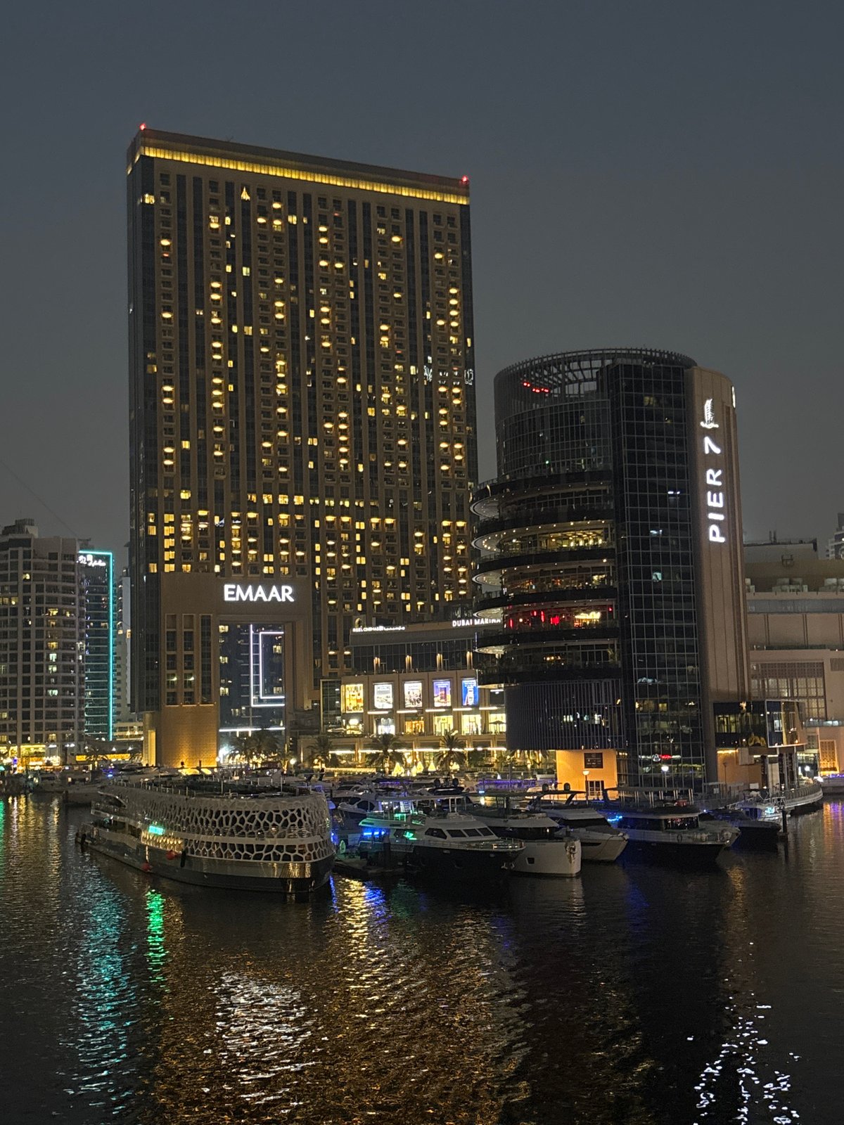 Dubai Marina skyline reflected in the water at night
