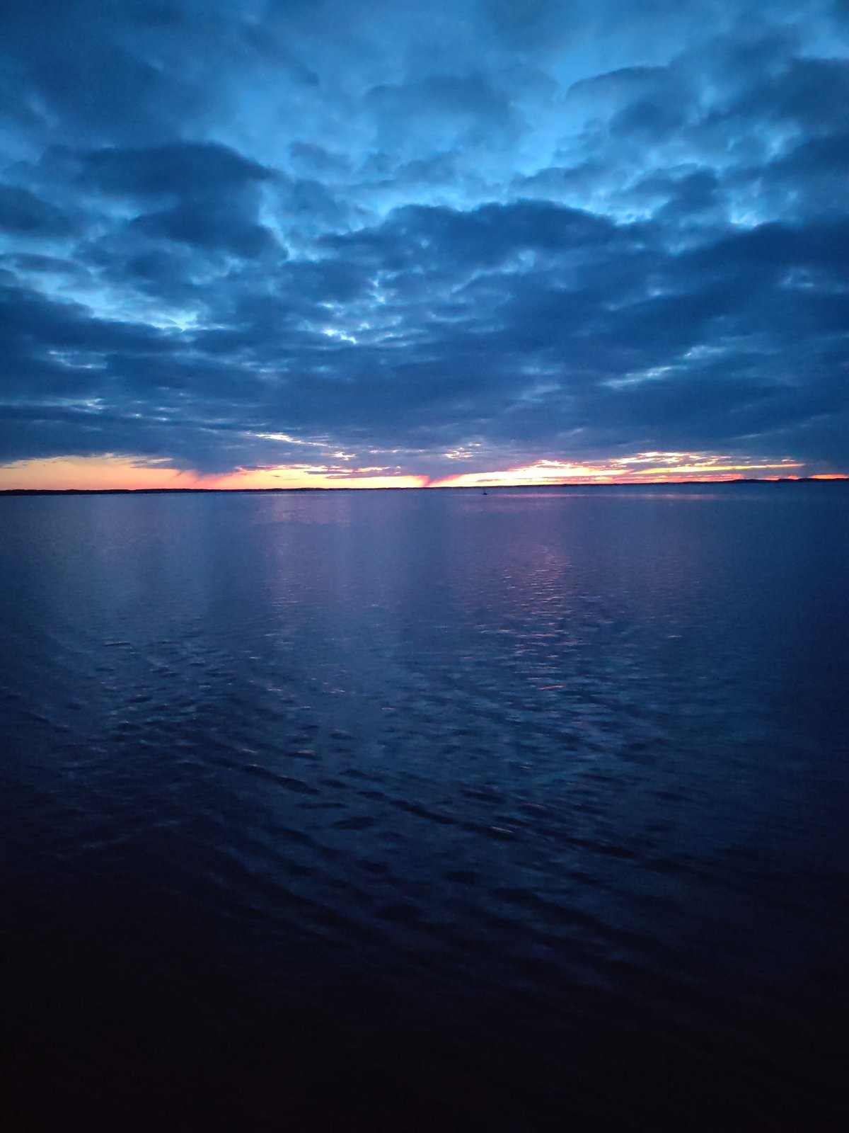 Dramatic dawn sky captured over Russian waterscape May 1