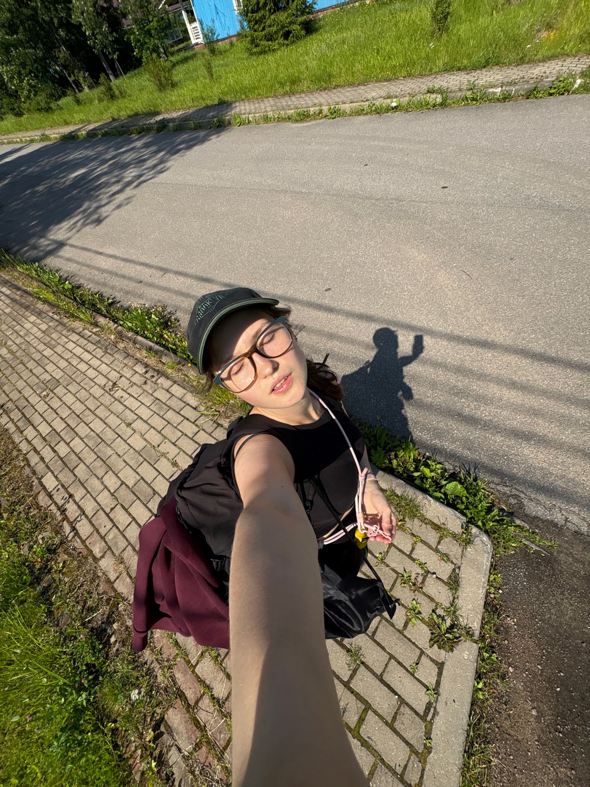 Casual selfie on a brick sidewalk in Solnechnoye