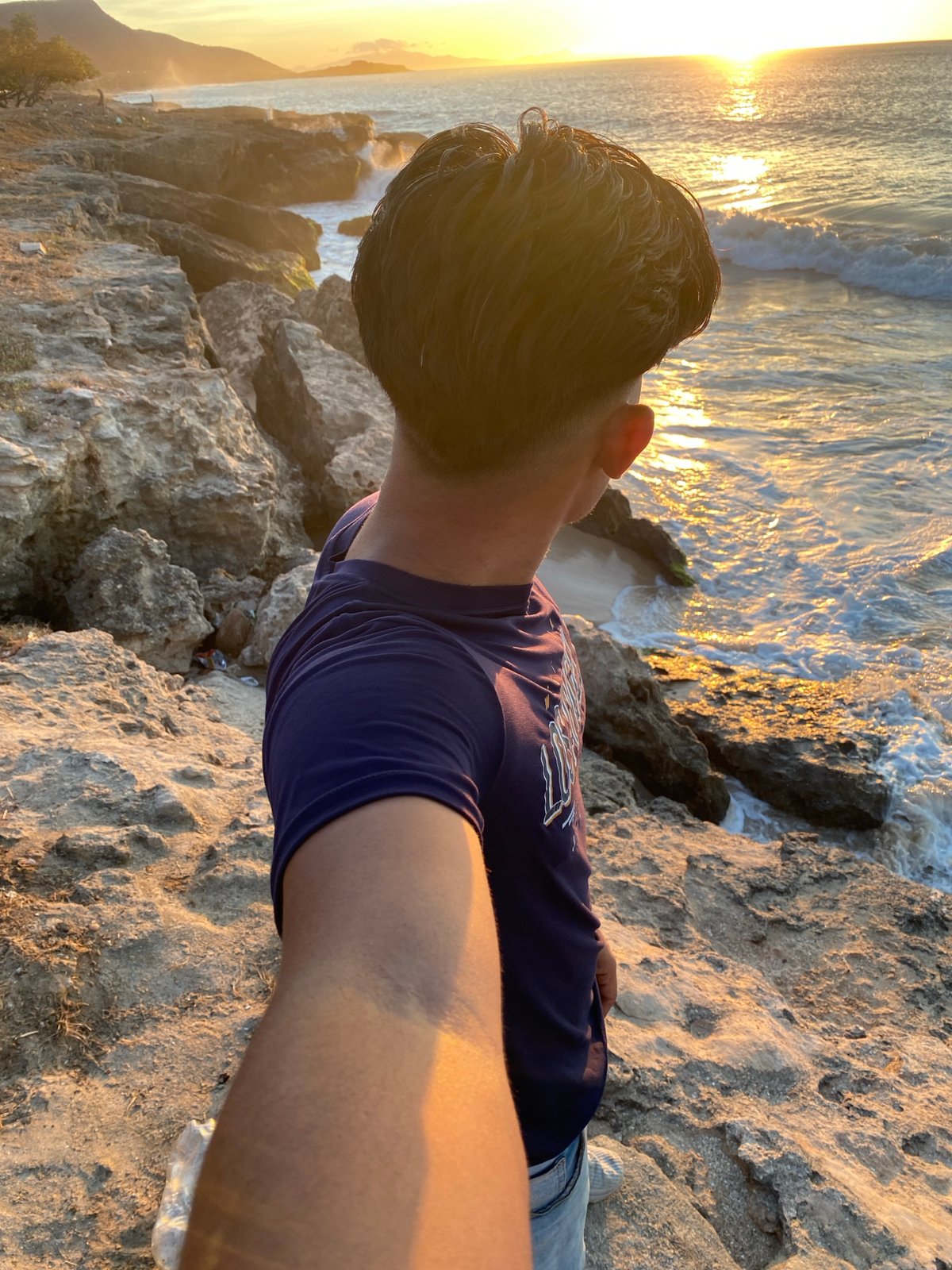 Sunset selfie session at Juan Griego beach rocks