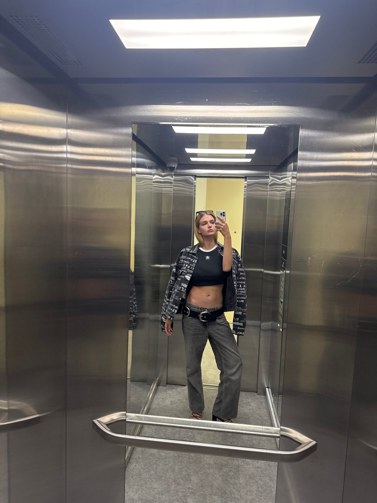 Woman documents morning routine through elevator and car selfies