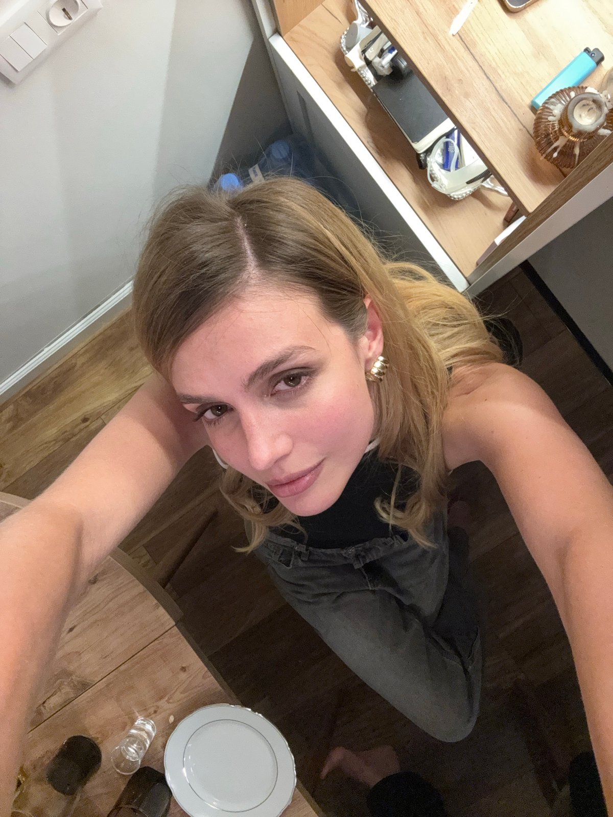 Woman takes selfie in residential setting