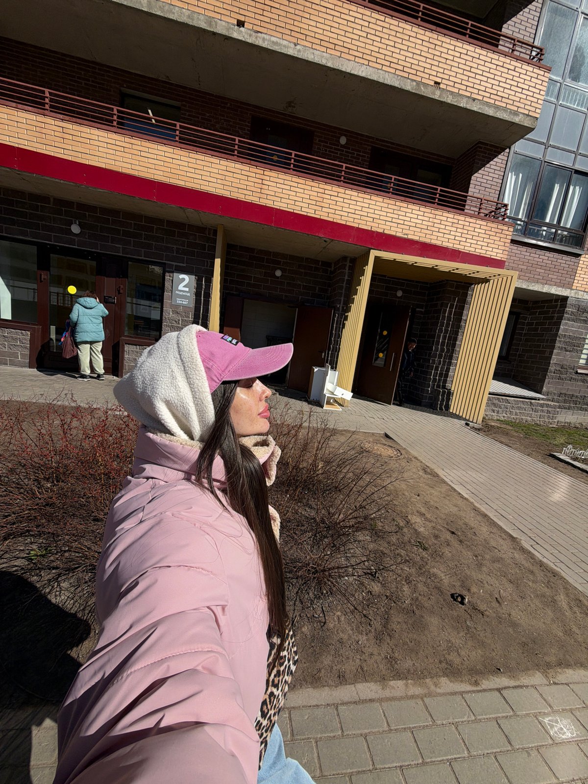 Woman in pink jacket spotted across Saint Petersburg locations