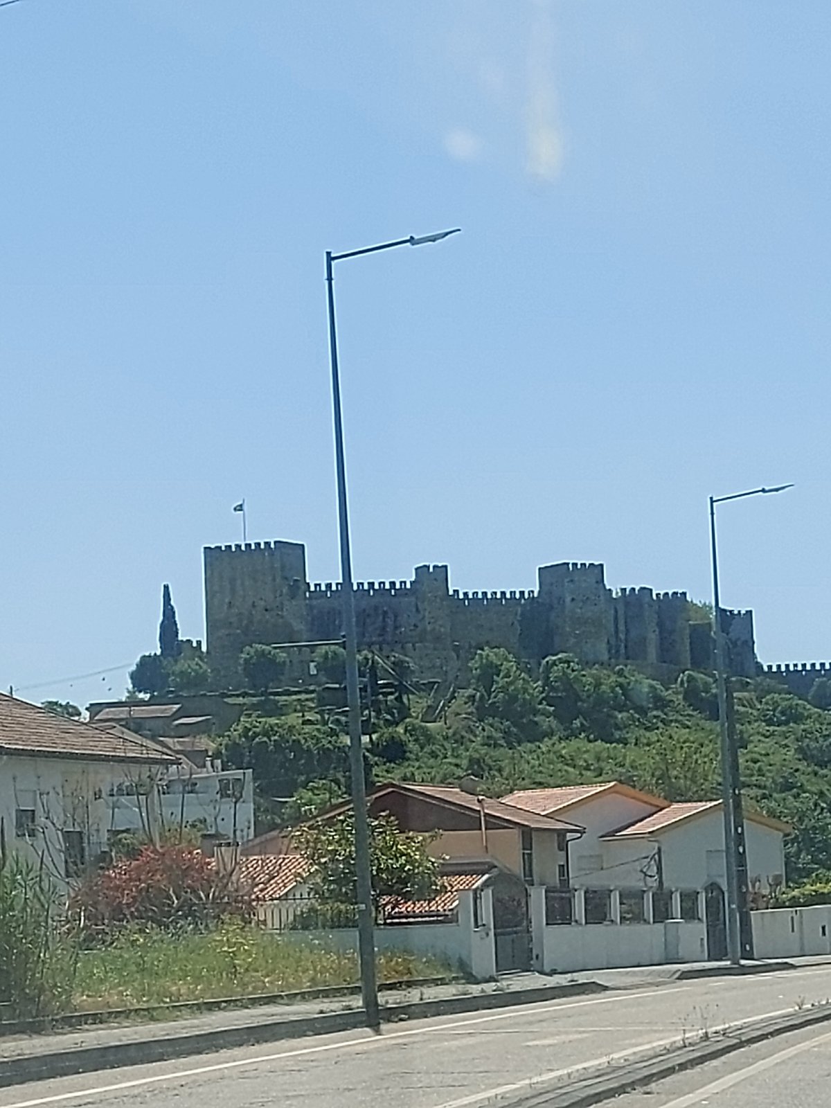 Historic Portuguese castle photographed from multiple angles in daylight