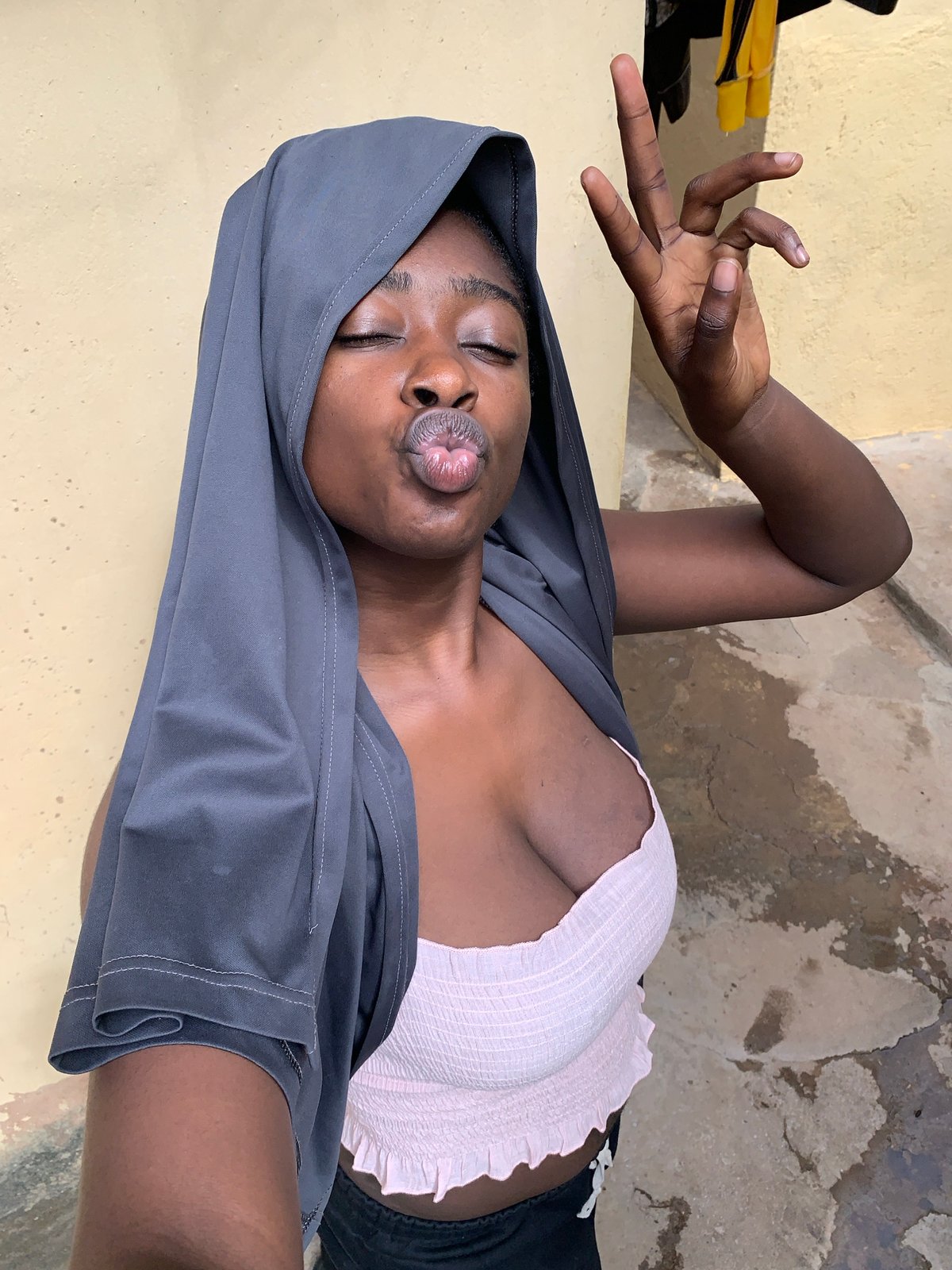 Woman poses playfully for photos in Rafin Par, Nigeria