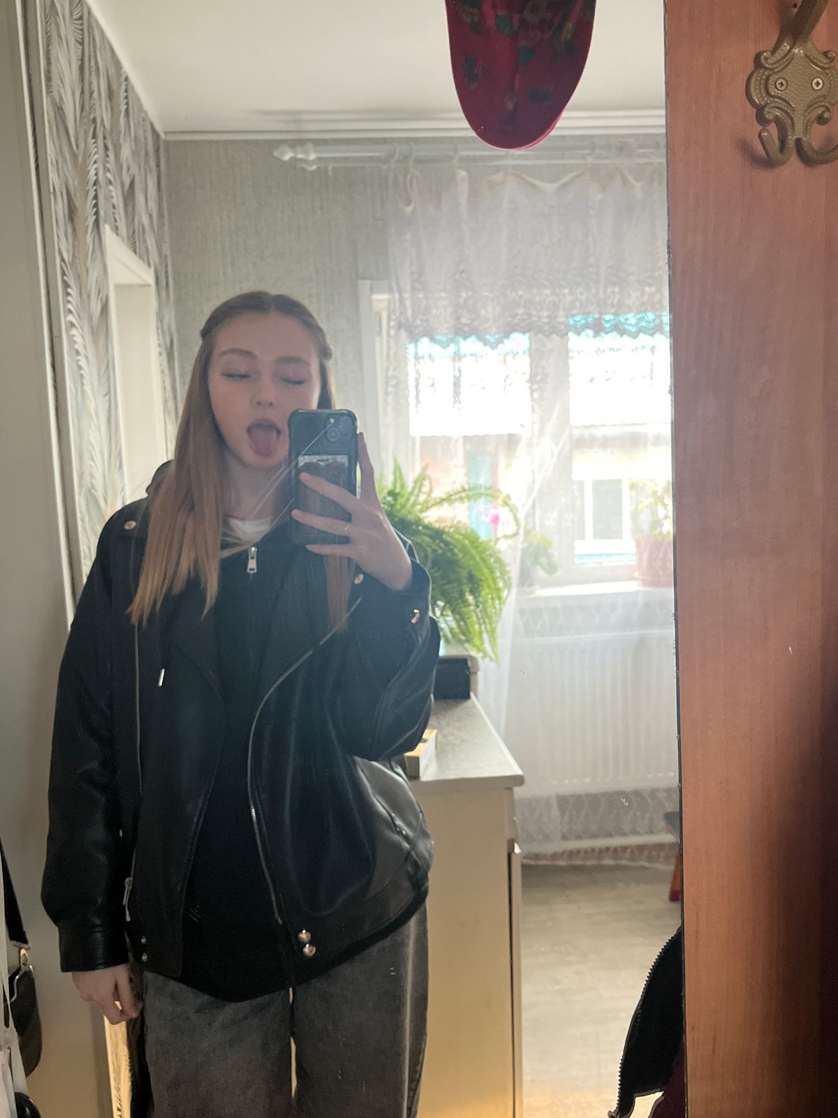 Woman takes casual selfies and photos in Chaikovsky home