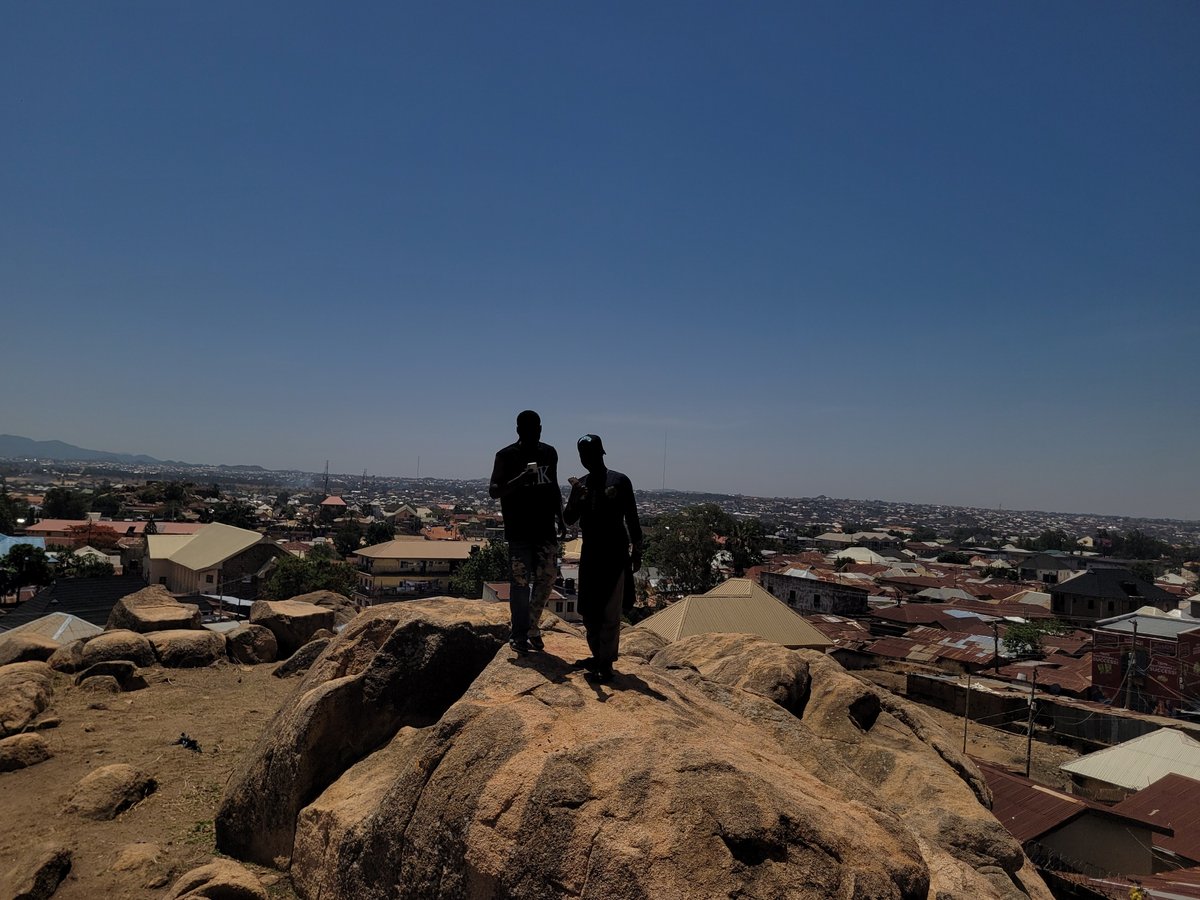 Residents gather on Jos rock formations for city overlook photos