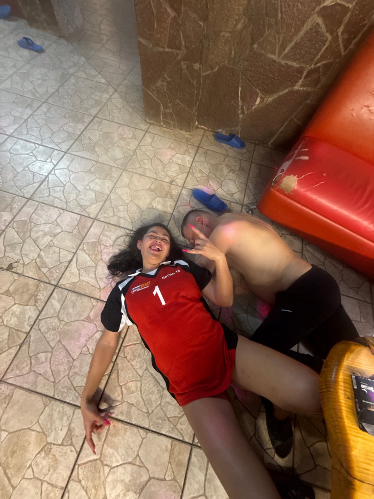 Couple observed resting on floor in Chaikovsky home
