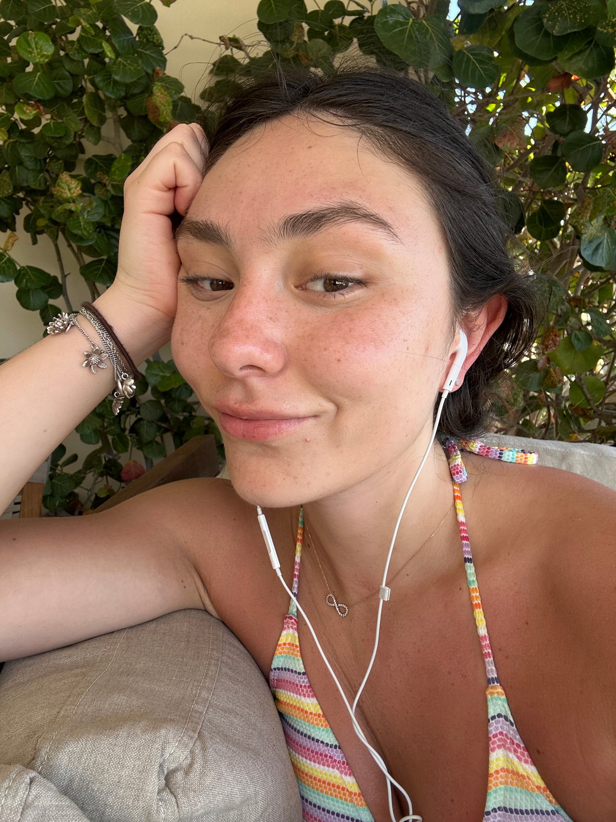 Woman spending leisure time at Playa Blanca resort patio