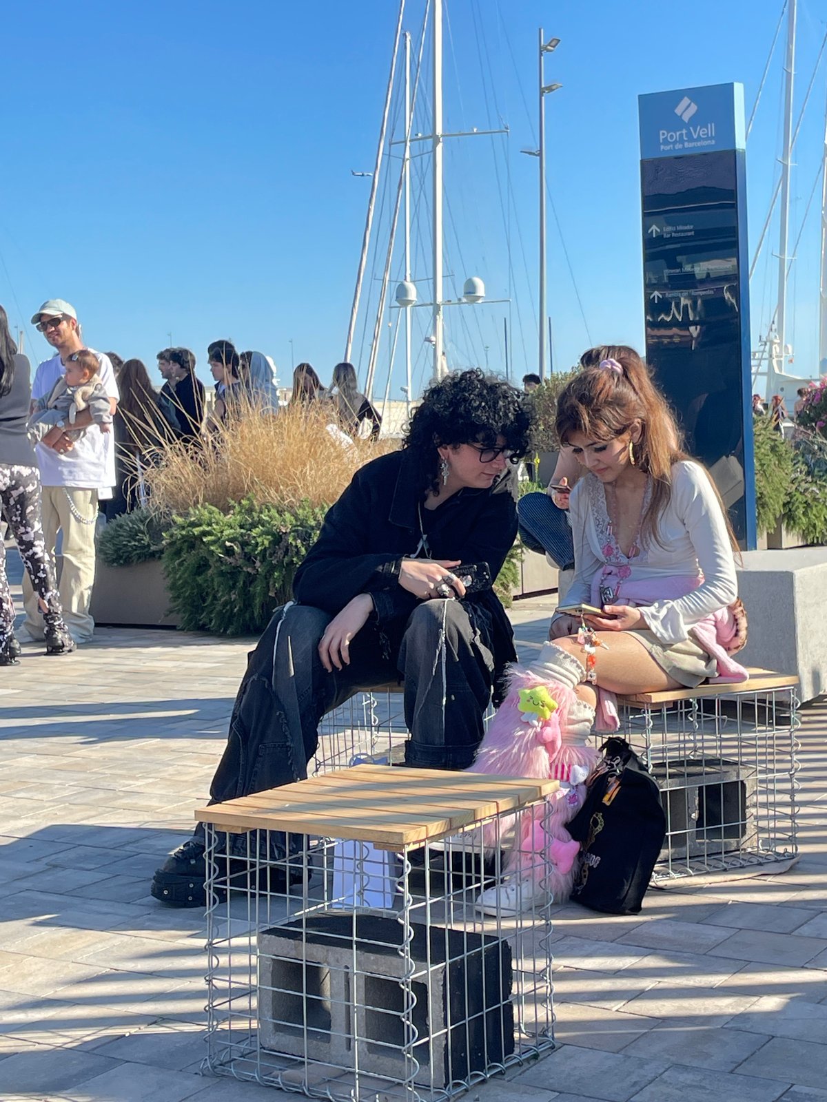 Sunny afternoon brings visitors to Barcelona's Port Vell waterfront