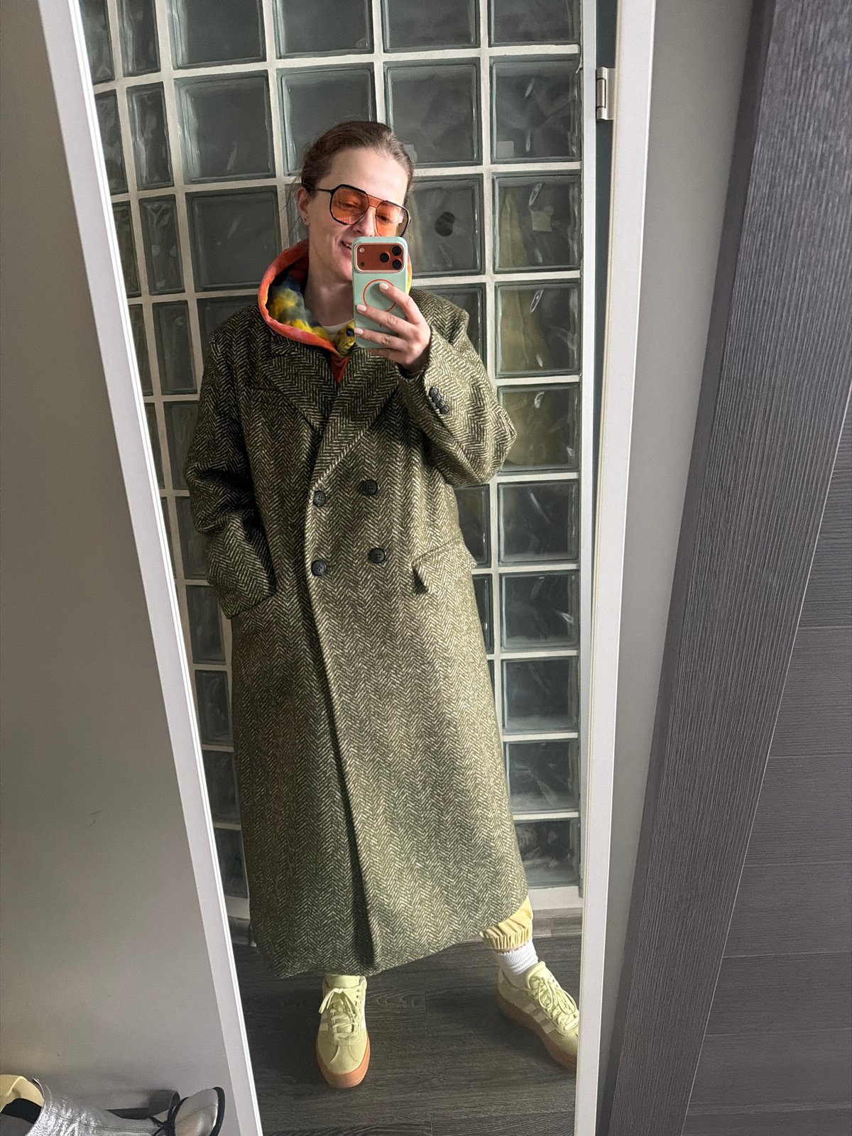 Person takes selfie in colorful outfit in Moscow