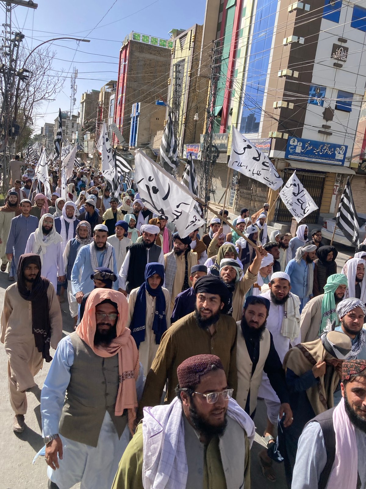 Men march in demonstration through Quetta streets carrying banners