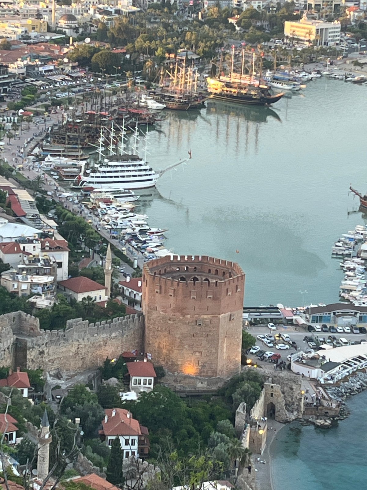 Tourists document scenic views of Turkey's historic Alanya coastline
