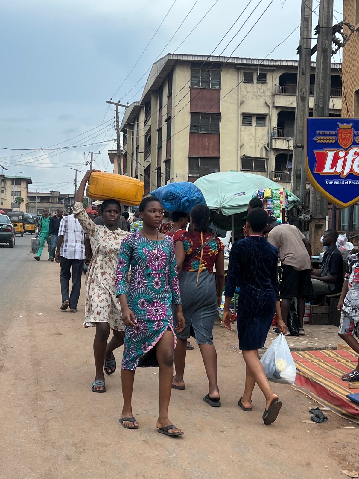 Afternoon street life in Nkpor's busy commercial district