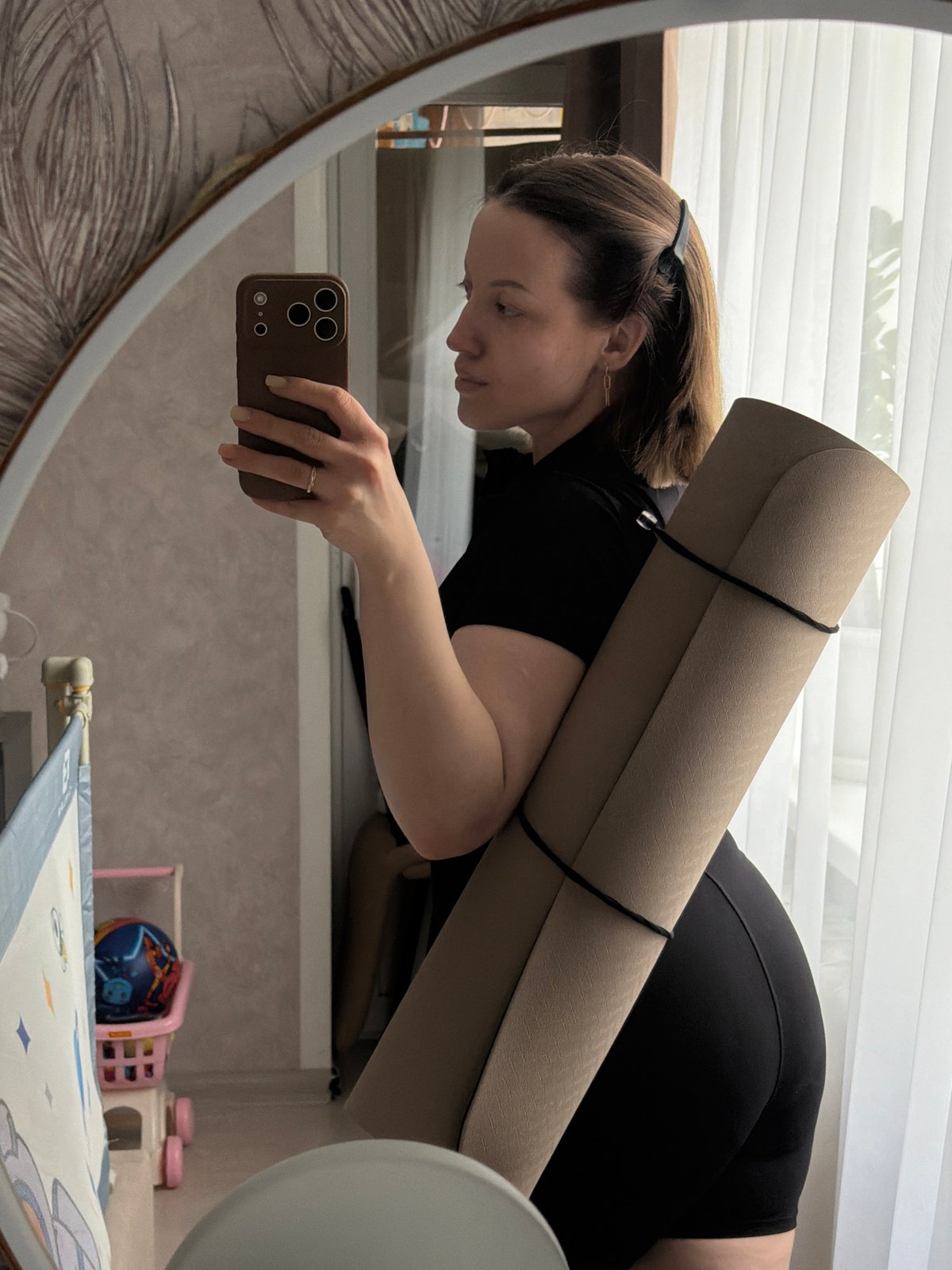 Woman Takes Mirror Selfies in Reshetnikovo Bedroom
