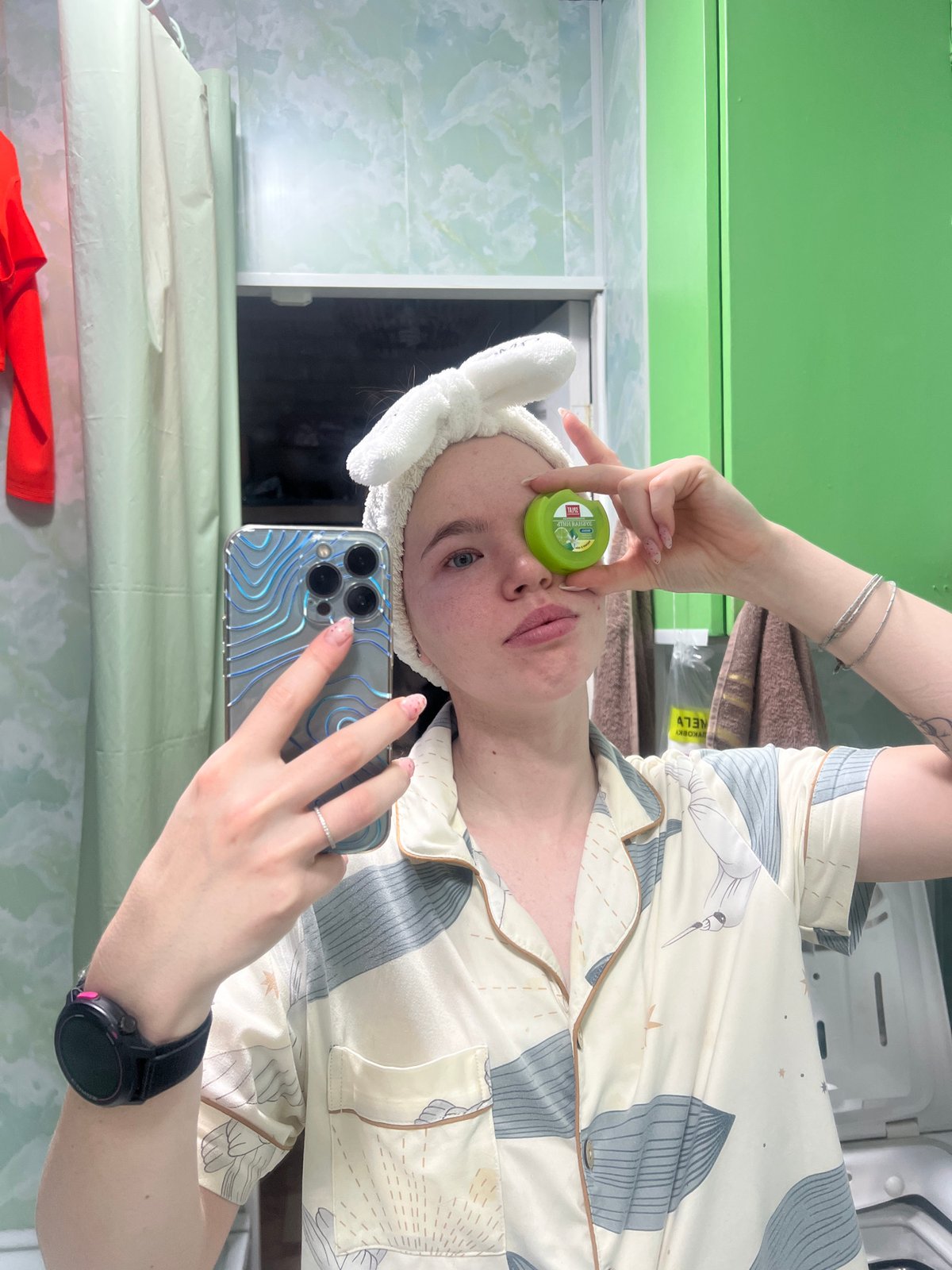Woman documents nighttime routine in bathroom selfies in Chaikovsky