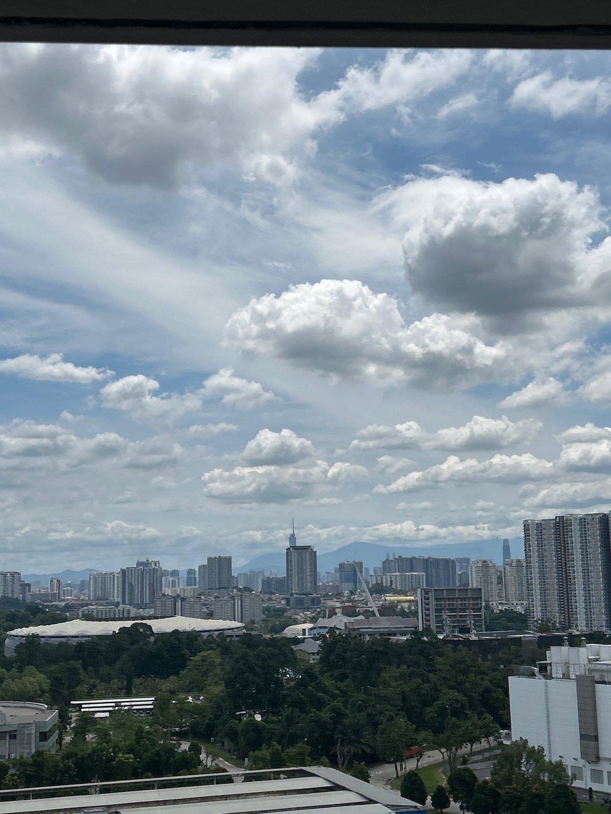 Early morning cloudy skies observed over Kuala Lumpur cityscape