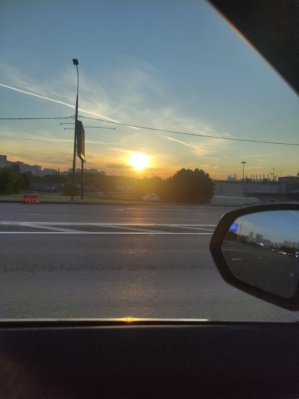Moscow street scene captured from vehicle during sunrise/sunset