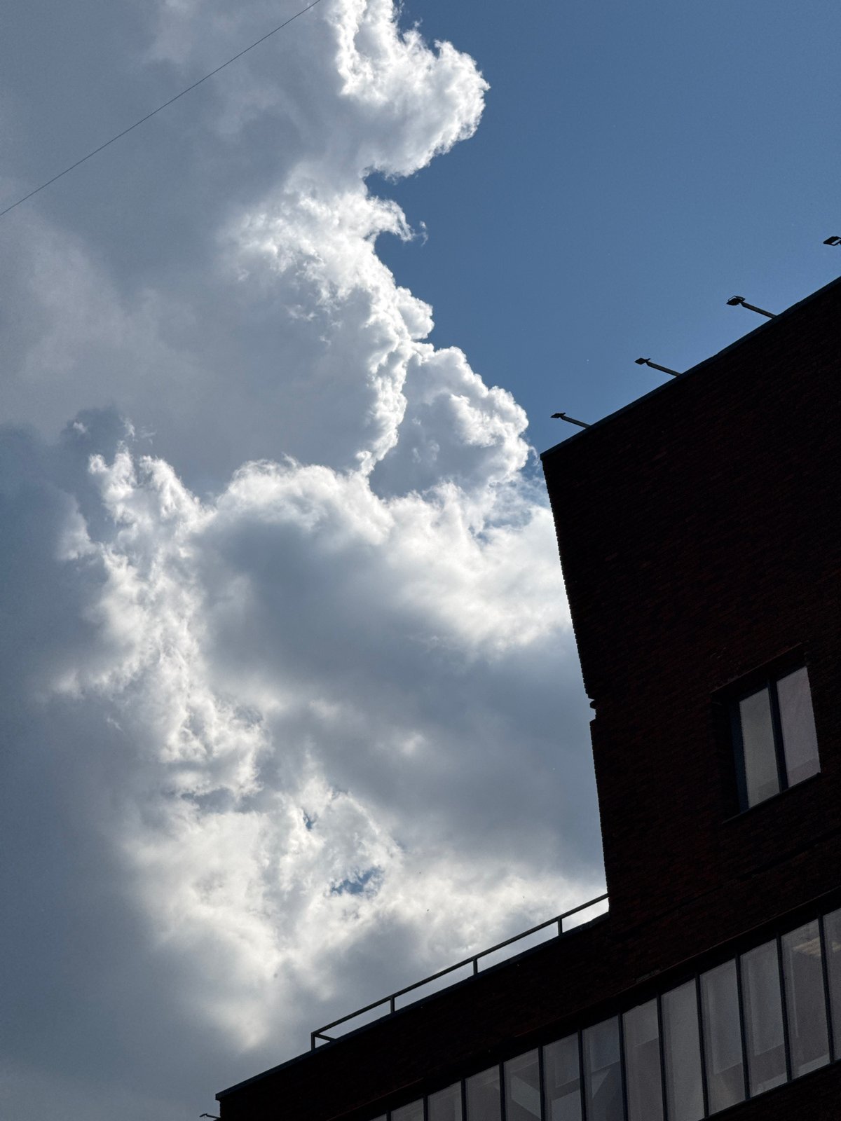Dramatic clouds frame Moscow construction site and buildings