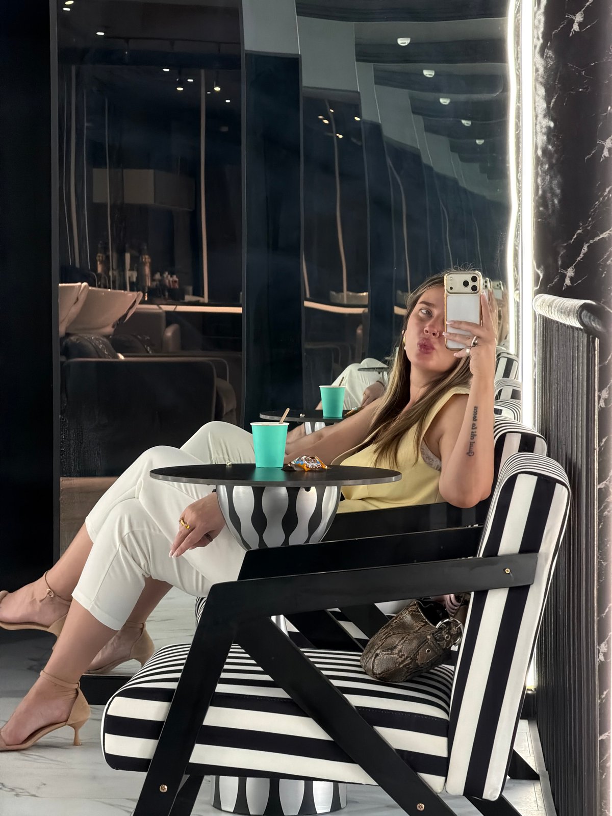 Woman takes selfie in stylish Moscow interior setting
